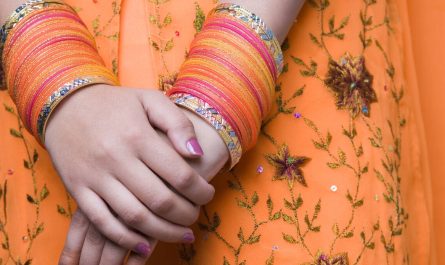 Close up of bangles on a woman's wrists