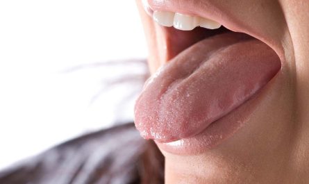 Close up of woman sticking out her tongue